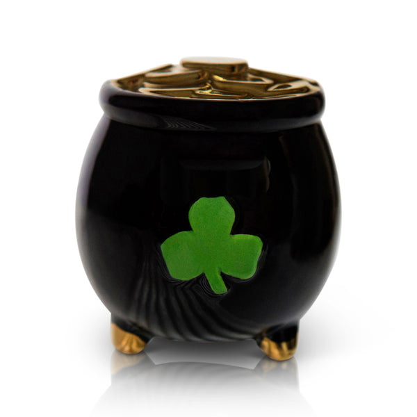Black pot with gold trim and feet, decorated with a green shamrock and filled with gold coins.