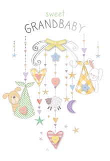 Wooden mobile with glittery animal figures hanging above a crib.