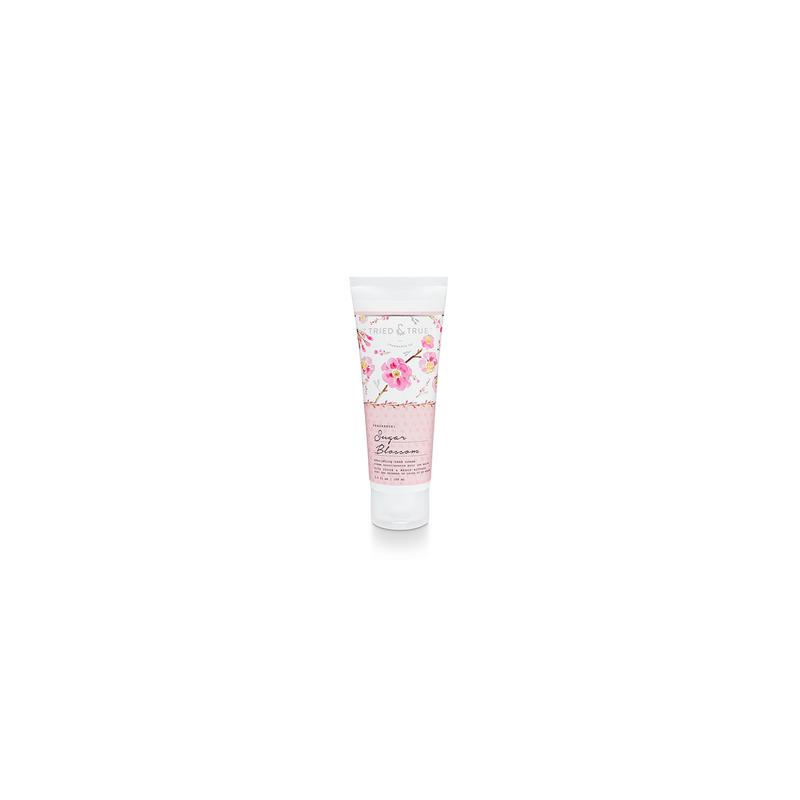 Tried & True Sugar Blossom hand cream in a white cylindrical tube with pink floral pattern.