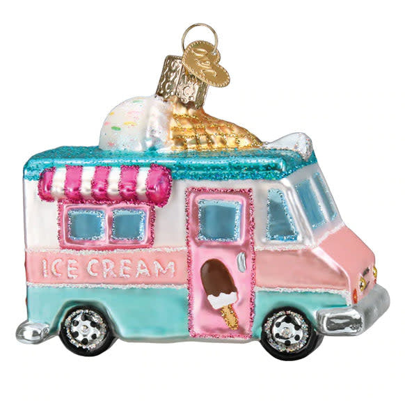 Glass Christmas ornament shaped like a red ice cream truck with white accents.