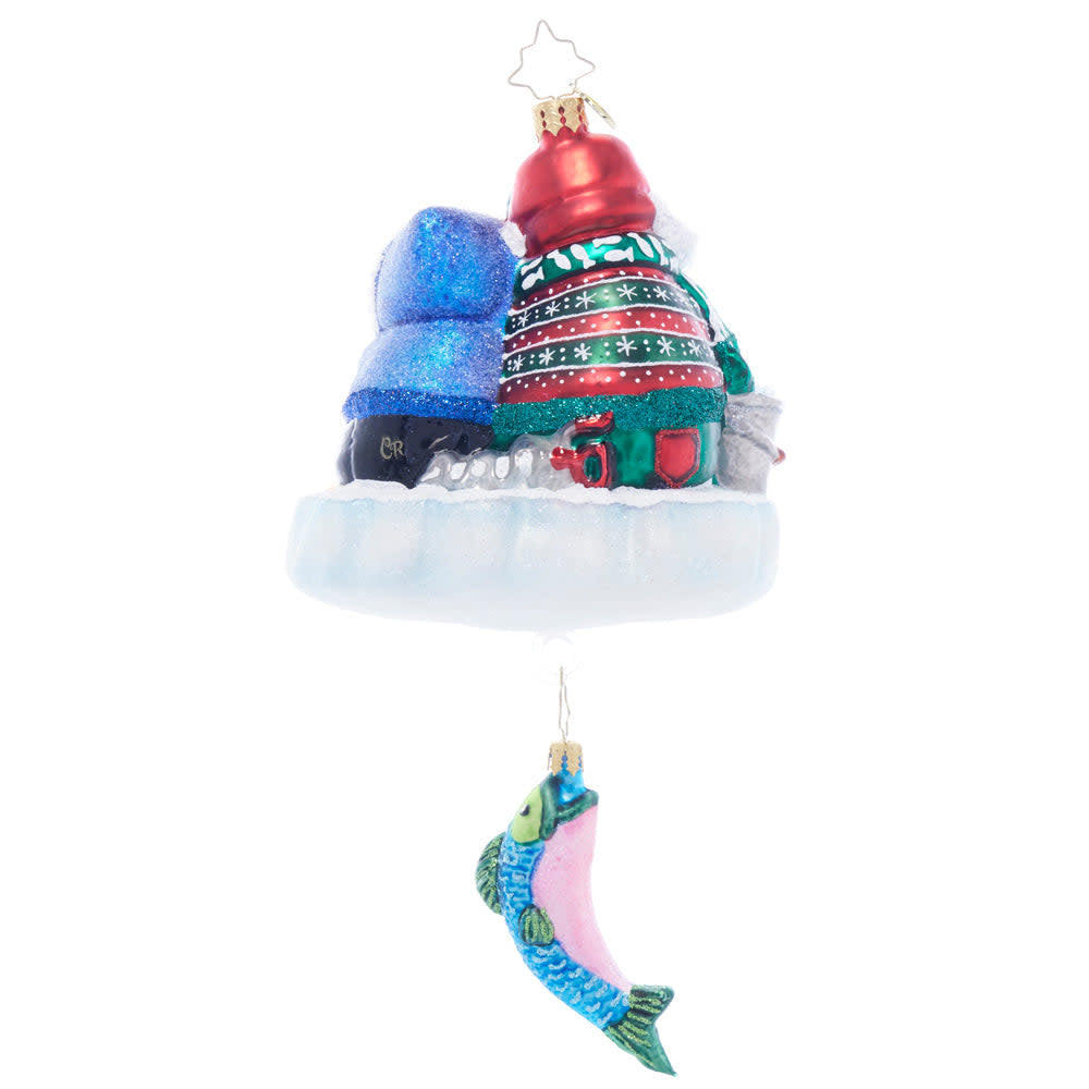 Back view of Ice Fishing Snow Pals figurine in blue plastic with fishing rod silhouette.