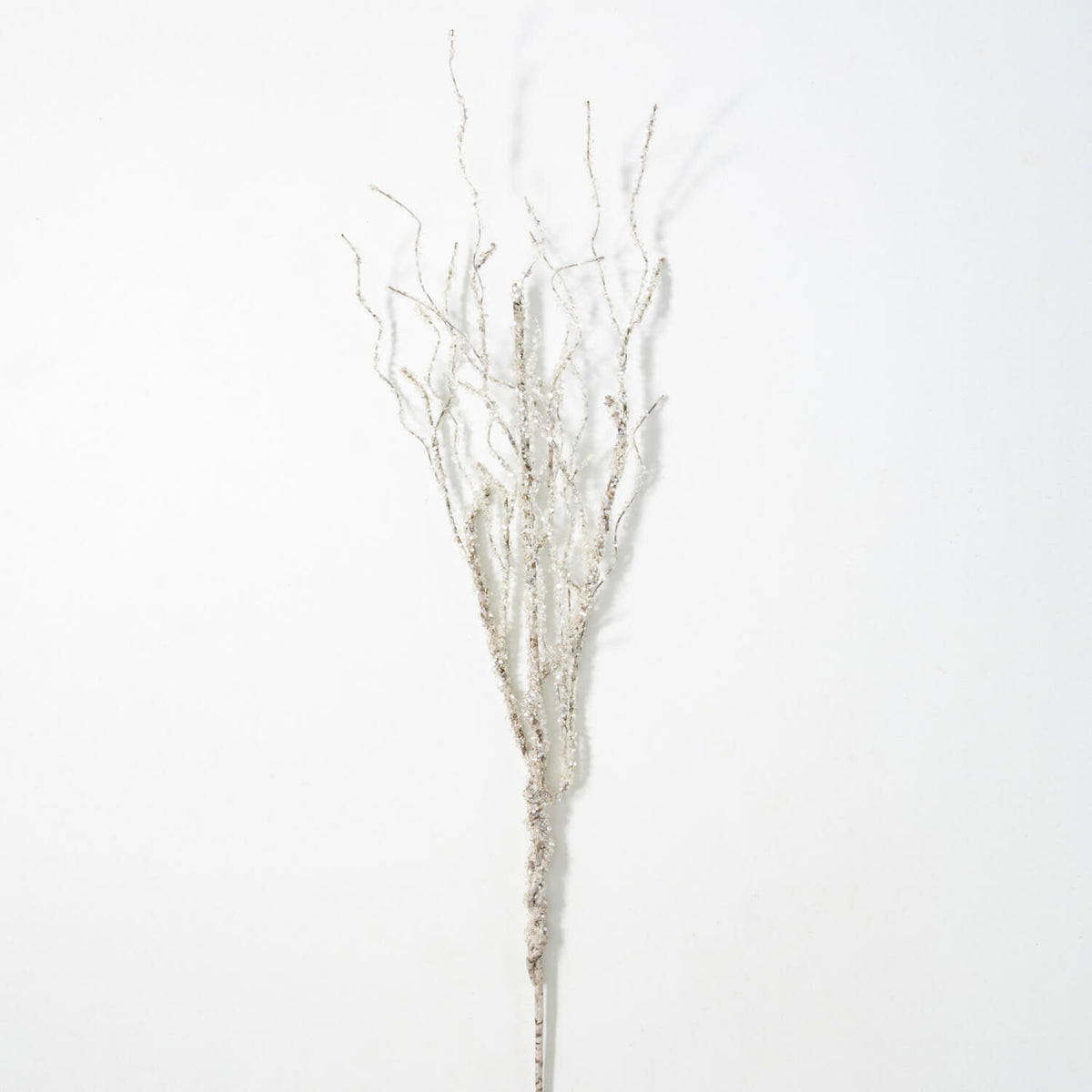 Plastic birch tree spray decoration in white with green leaves.