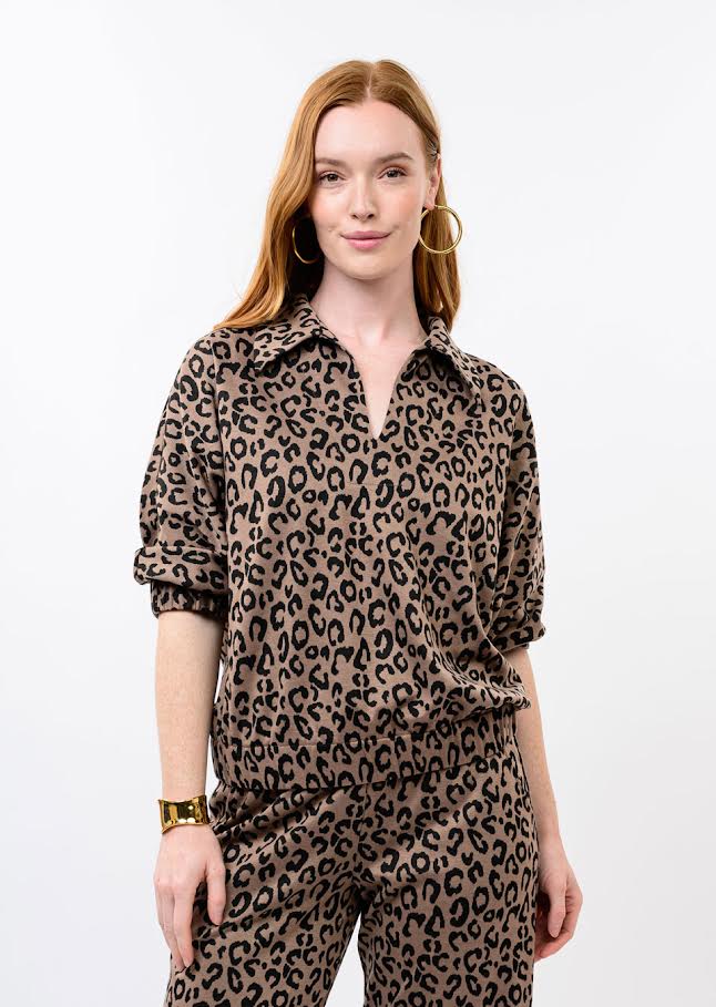 Woman wearing the Caren Knit Popover Top in a brown and black leopard print with matching pants.