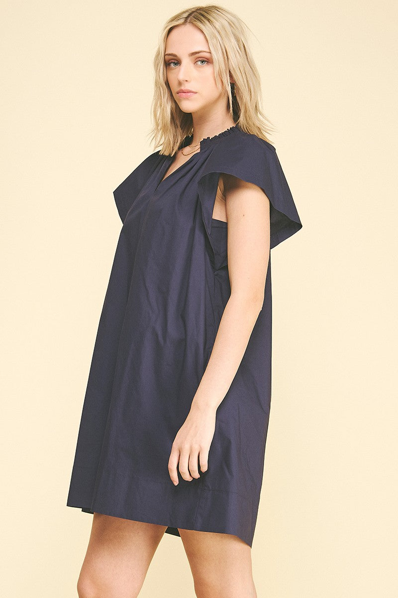 Amelia ruffle detailed tunic mini dress in white cotton with a flared silhouette.