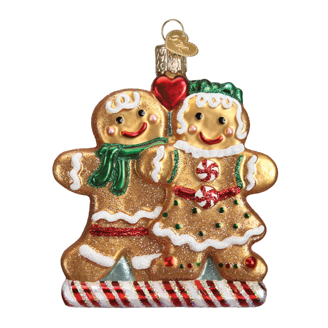 Mouth-blown glass gingerbread ornament with hand-painted silver interior and glitter accents.