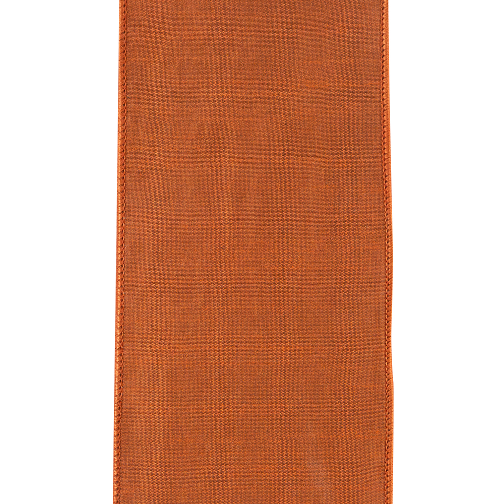 Close-up of 4-inch wide copper velvet filigree ribbon with wired edges and a textured finish.