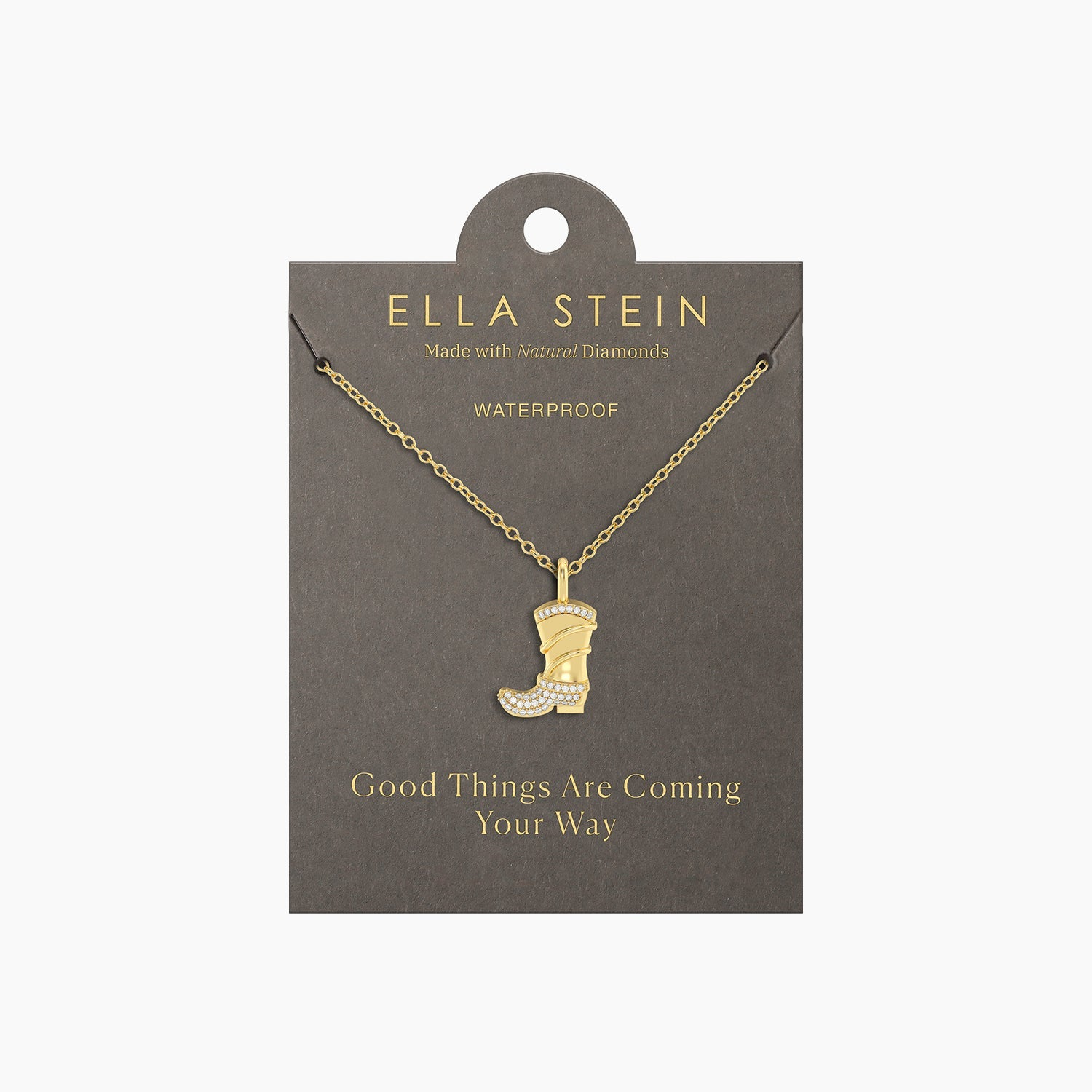 Gold cowgirl boot pendant necklace with diamond accents on a grey display card.