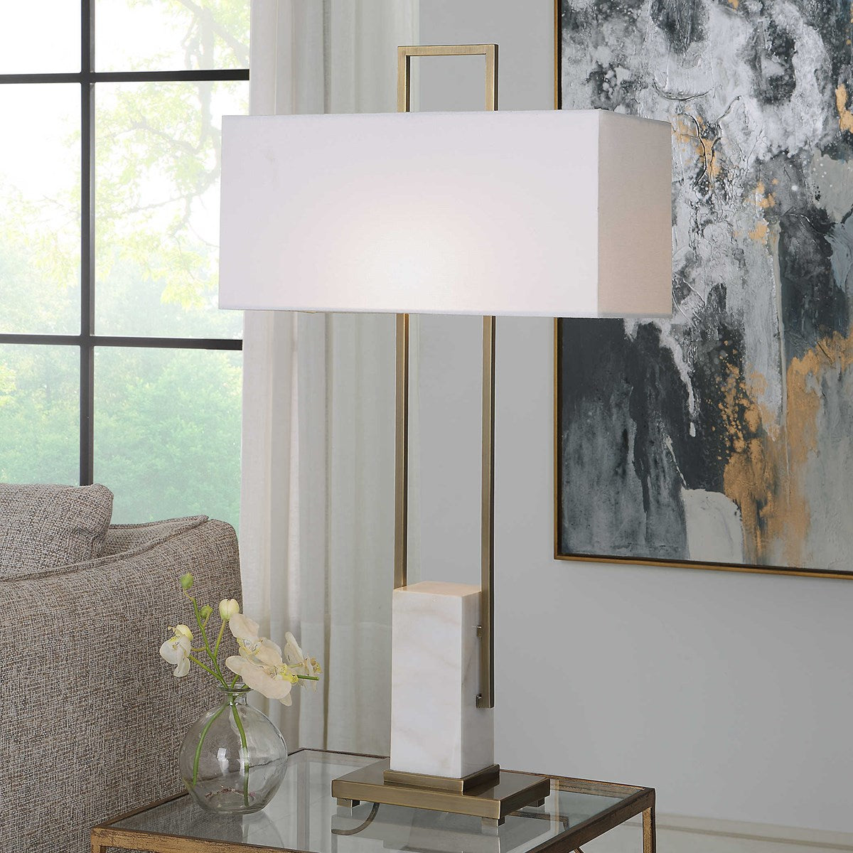 Black column table lamp with a cylindrical shade featuring an on-line switch.