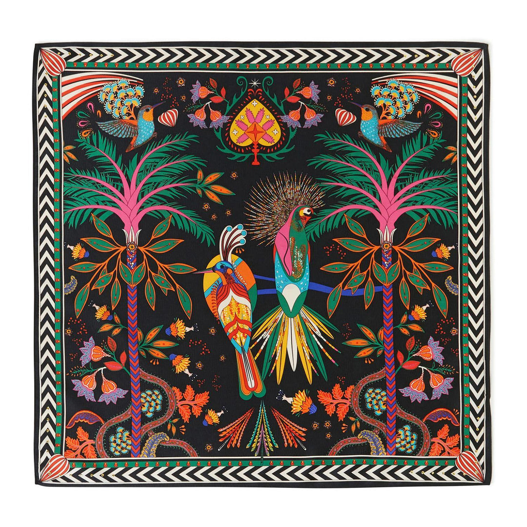 Mini square scarf with a vibrant tropical bird and palm tree illustration on a black background.