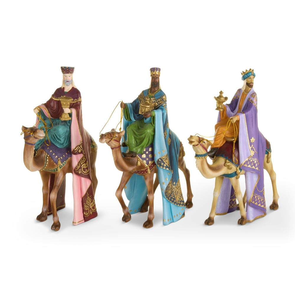 Set of three 18-inch regal wise men figurines in colorful robes riding camels.
