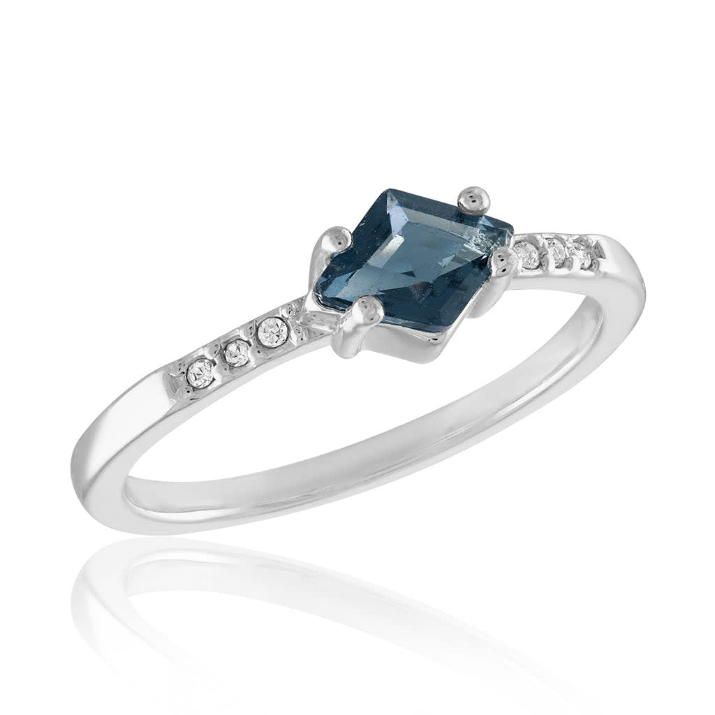 Montana Blue Solitaire Stack Ring featuring a round blue gemstone in a sleek silver band.