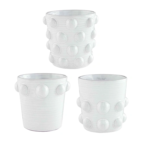 Terra cotta beaded pot with a round silhouette featuring intricate beadwork patterns.