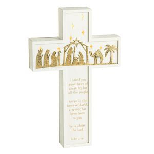 White light-up cross featuring a gold nativity scene and Luke 2:10-11 scripture text.