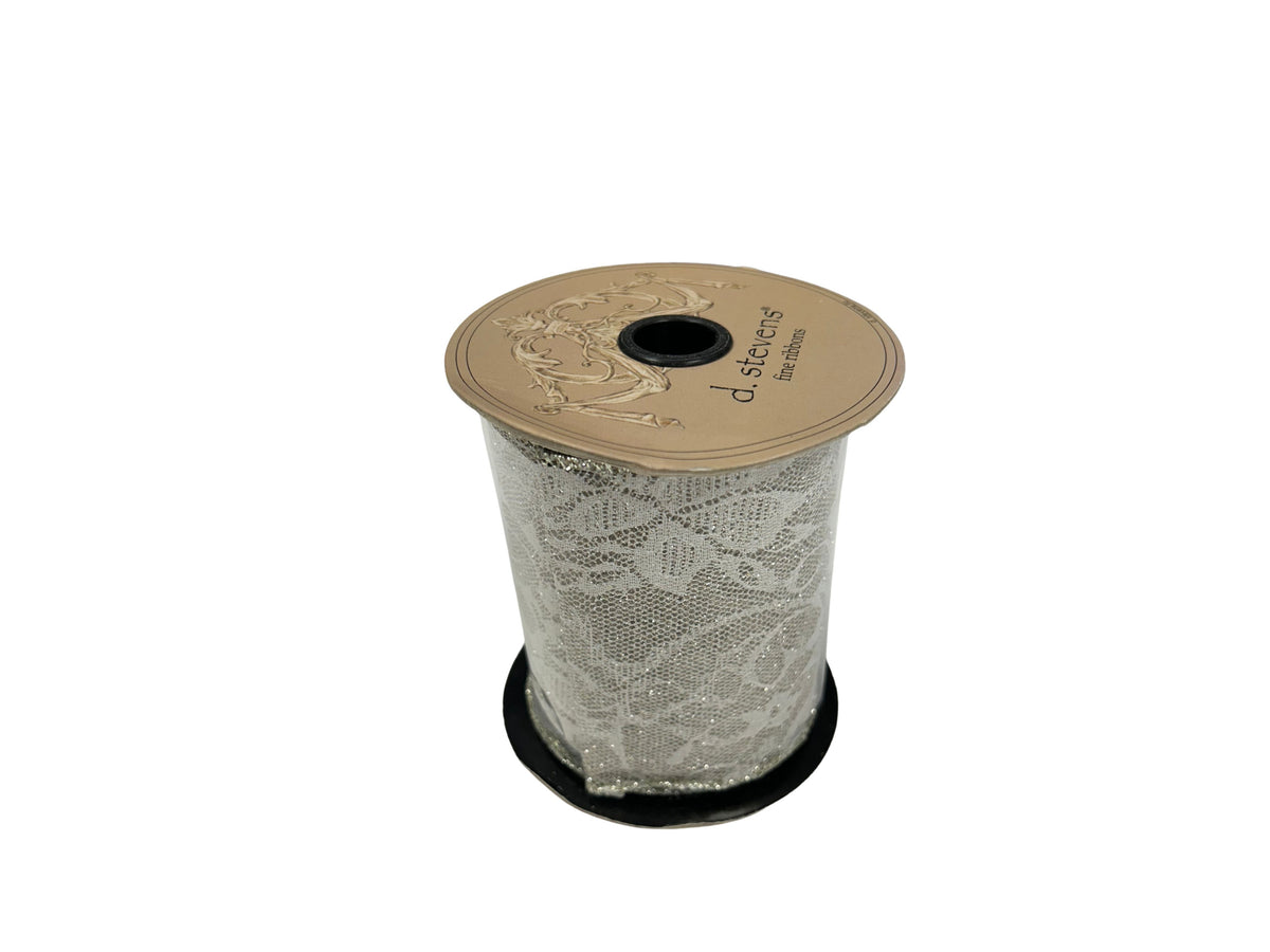 Spool of d. stevens fine ribbon featuring a white lace pattern with silver glitter accents.