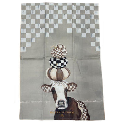 Mocha Cow Printed Dish Towel featuring a cow with stacked pumpkins and a checkered pattern.