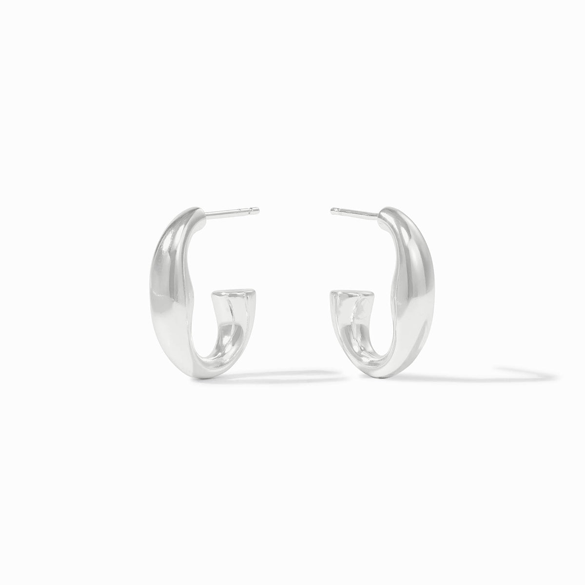 A pair of silver Laguna Hoop earrings with a thick, curved design and post backings.