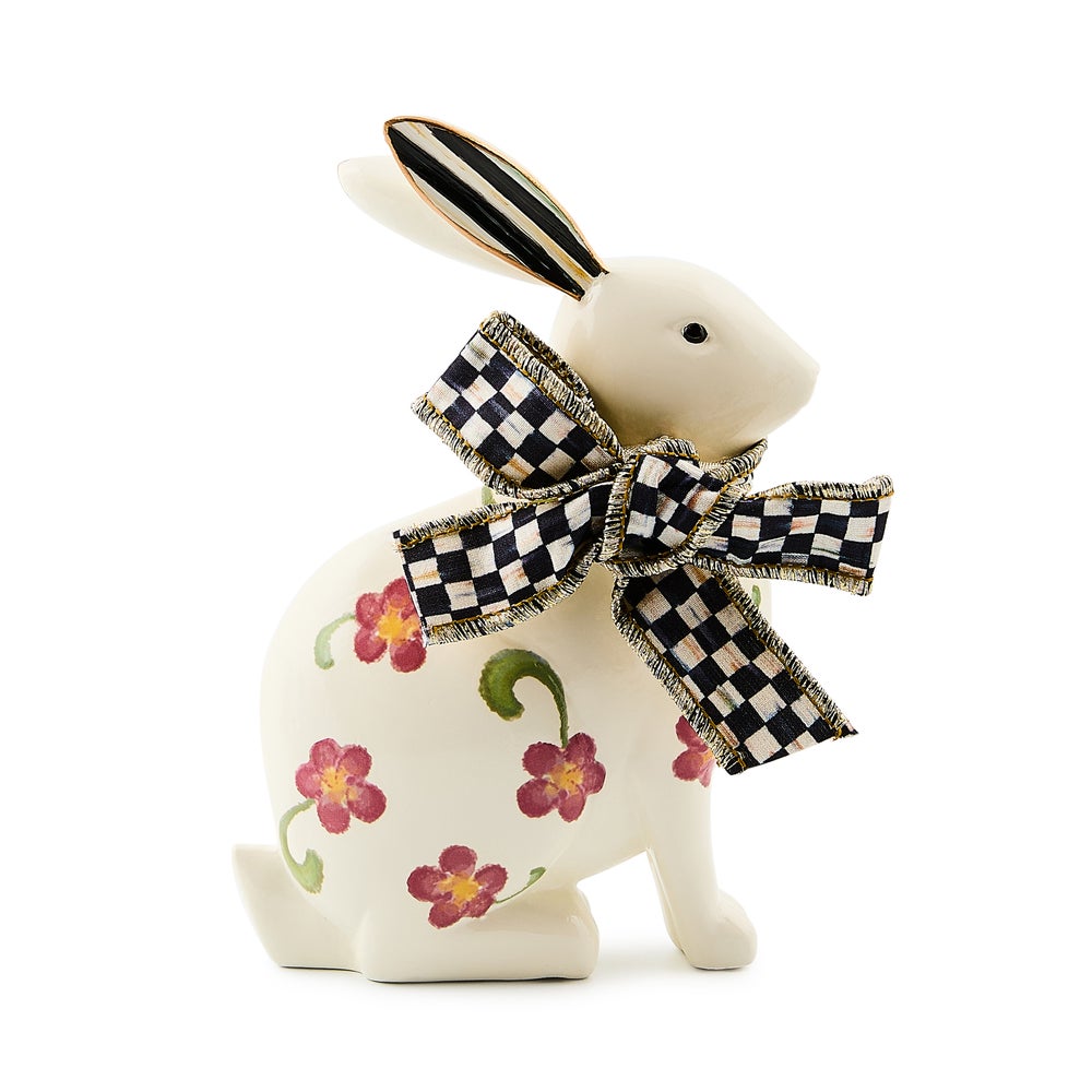 Resin floral rabbit figurine with a pastel pink hue and delicate petal patterns on its ears.