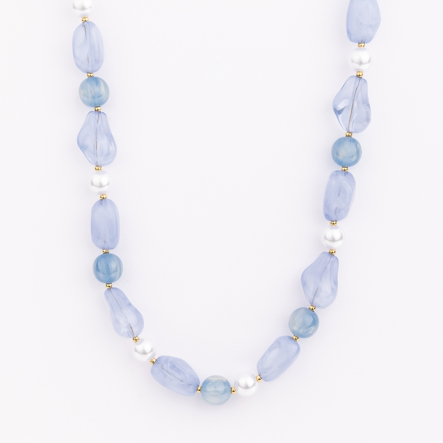 Zoe Necklace featuring chunky blue resin beads and white pearls with gold-plated metal accents.