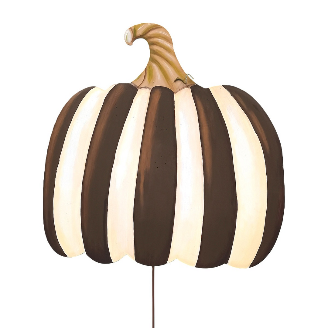 Large metal pumpkin decoration with vertical chocolate brown and cream stripes and a curved stem.