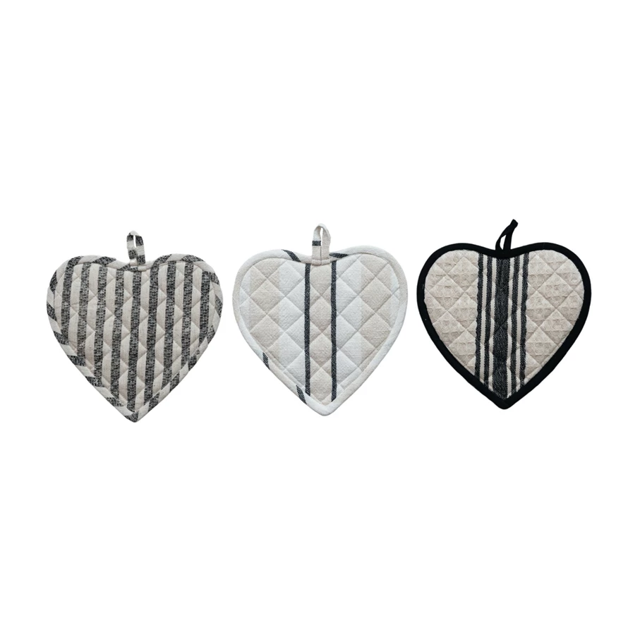 Set of three cotton quilted heart-shaped pot holders in various grey and white striped patterns.