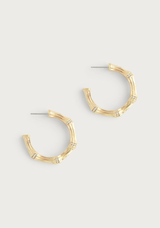 Gold-plated bamboo-textured medium hoop earrings with crystal pavé accents.