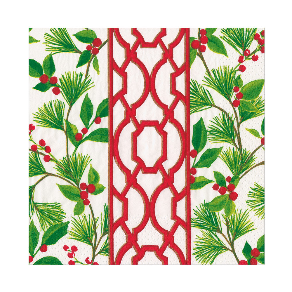 White luncheon napkin featuring a red geometric knot border and green pine branches with red berries