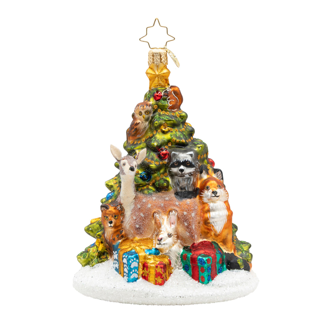 Woodland Celebration glass ornament featuring forest animals around a snow-dusted Christmas tree.