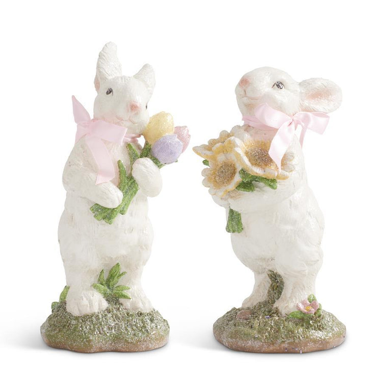 Polyresin bunny figurine in pink with a bow holding flowers