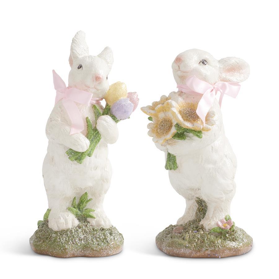 Polyresin bunny figurine in pink with a bow holding flowers