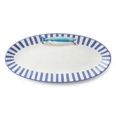Oval ceramic platter with blue and white striped rim and a hand-painted fish illustration.