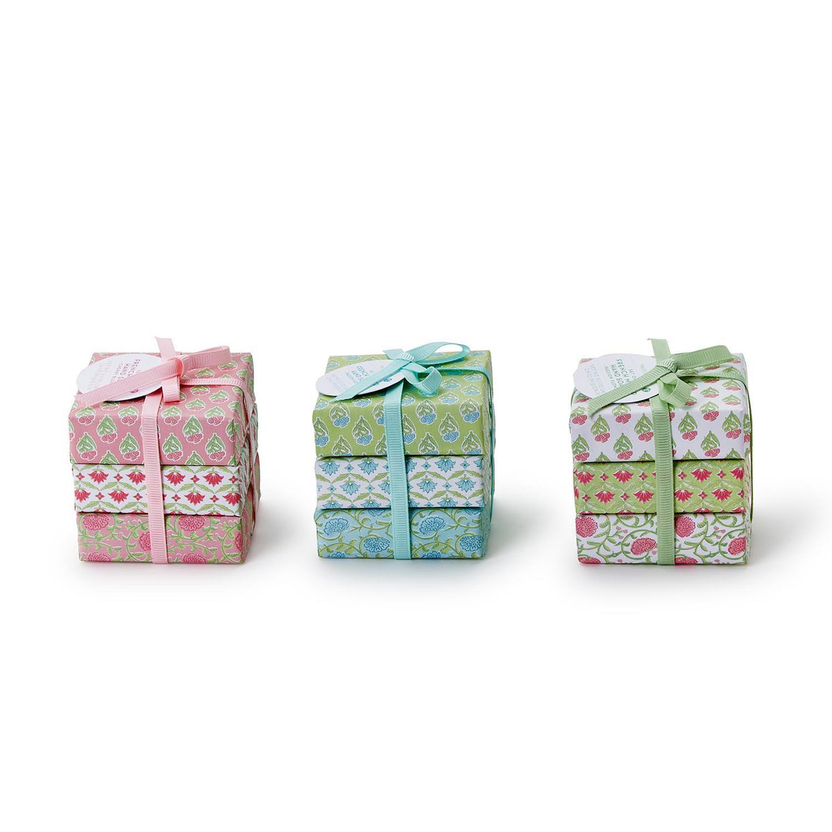 Floral block print wrapped soap bar in soft pastel tones with intricate botanical patterns on a white background.