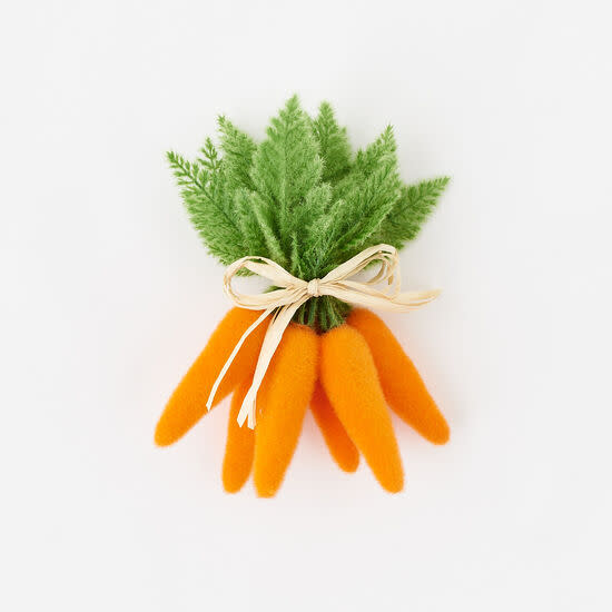 Large flocked orange carrot figurine with a textured surface.