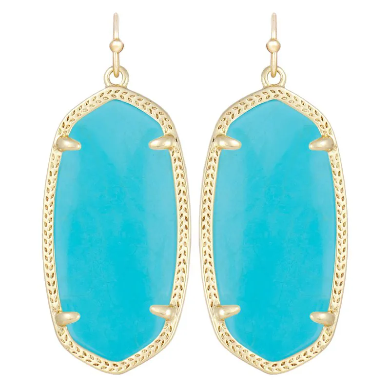 Elle drop earrings in 14k yellow gold over brass featuring a custom-cut shell design.