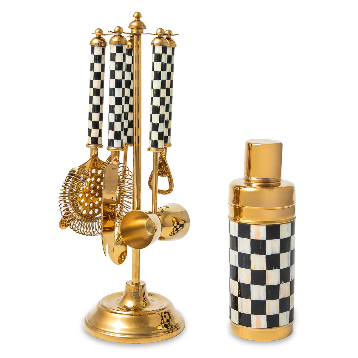 Gold bar set with black and white checkered handles, including a shaker and tools on a stand.