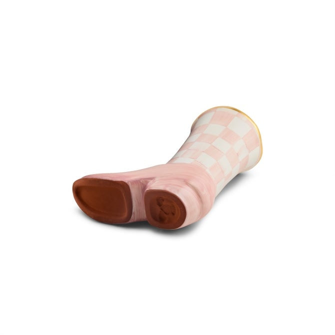 Pink and white checkered ceramic cowboy boot bud vase with gold rim and brown sole.