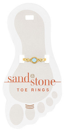 Gold-tone Sand & Stone toe ring with a light blue center stone on a foot-shaped display card.