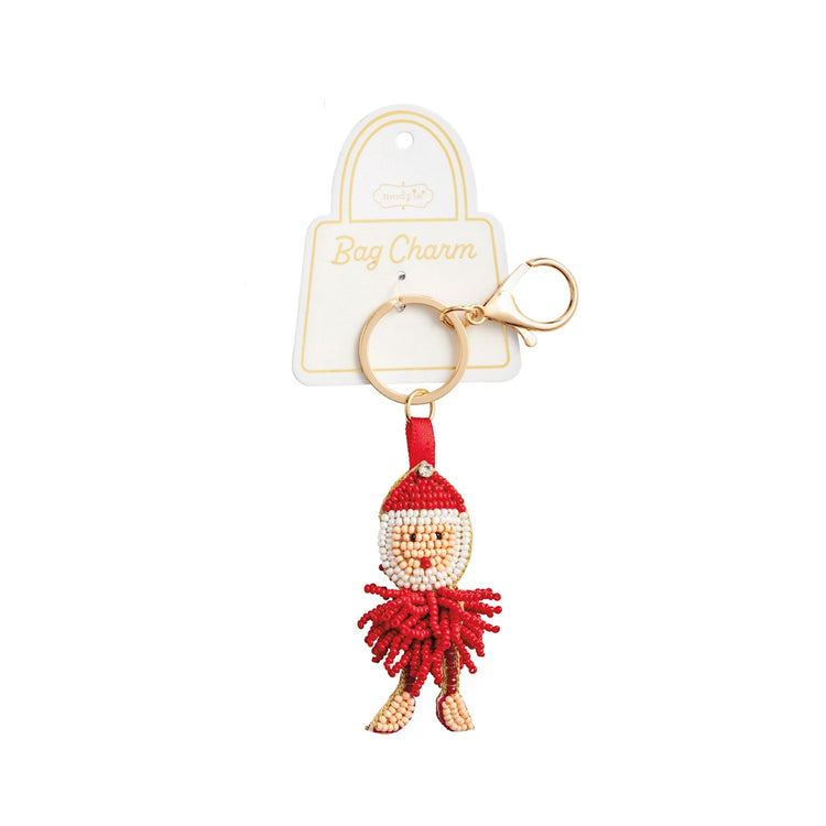 Hand-beaded Santa Claus bag charm with a gold metal key ring and lobster clasp on a display card.