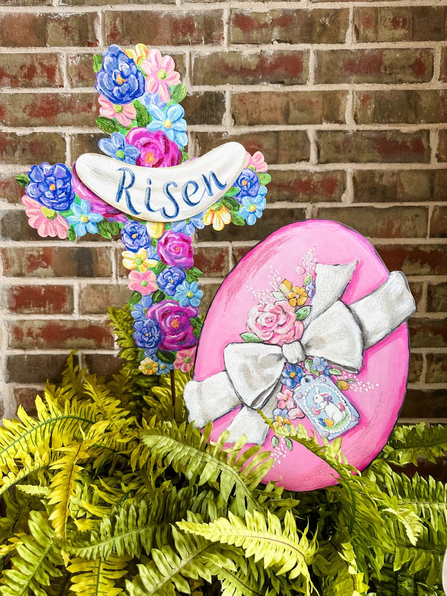 Risen Floral Cross stake with white finish featuring a floral vine pattern around the cross silhouette.