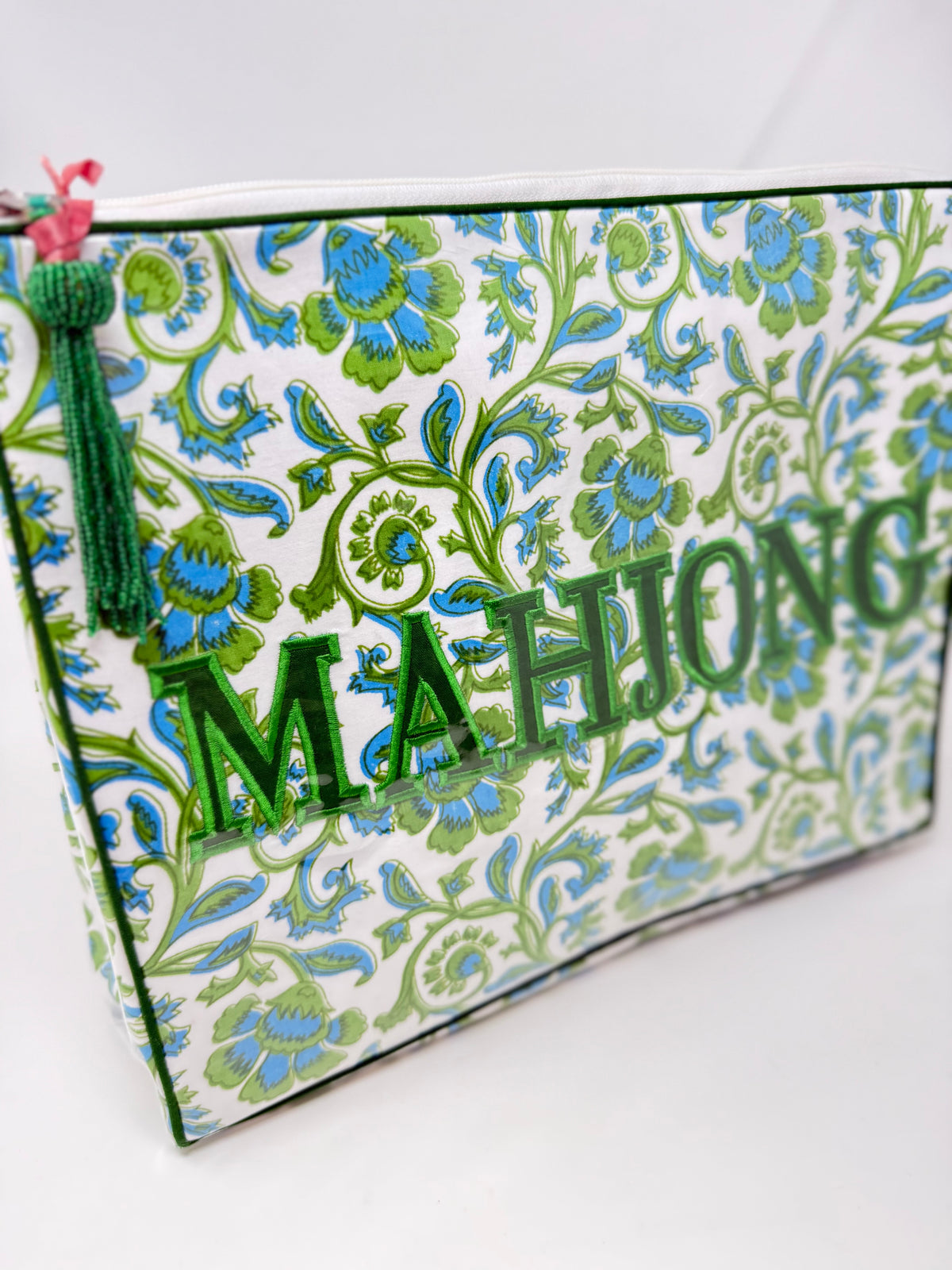 Vogue Bag with green and blue floral pattern and green embroidered "MAHJONG" text.
