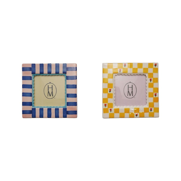 Two square stoneware photo frames: one pink and blue striped, one yellow and white checkered.