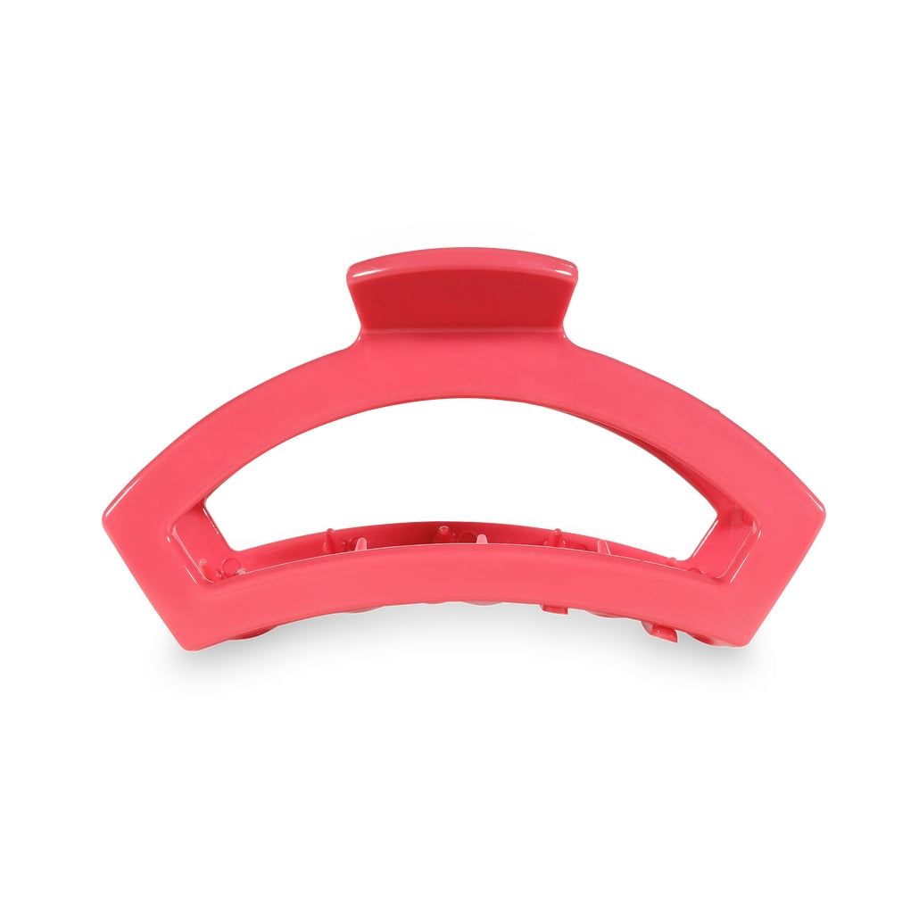Medium open-style hair clip with bendable teeth in a natural finish.