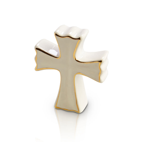 Small white ceramic cross with gold trim and a wavy edge design.
