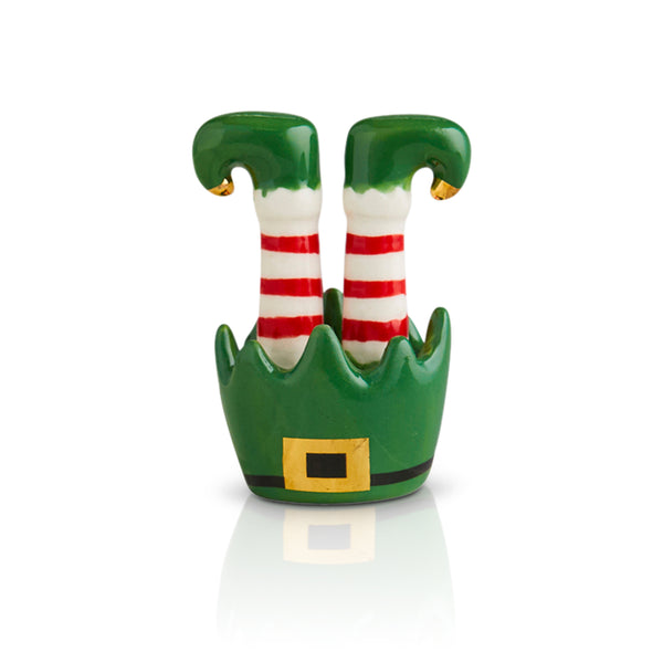 Ceramic elf legs with red and white striped socks and green elf shoes in a green elf hat base.