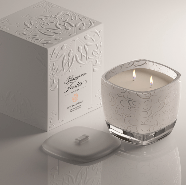 Moroccan Azahar candle in a cylindrical glass jar with an off-white wax and wooden wick.