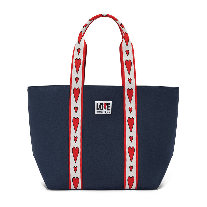 Navy blue velveteen tote bag with red heart-patterned straps and a 'LOVE Brighton' patch.