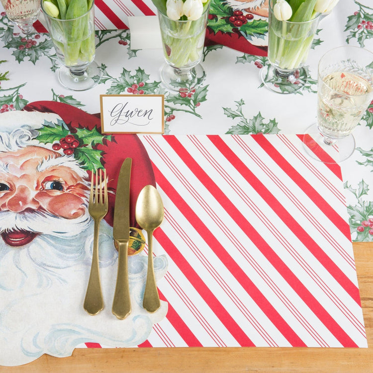 Candy Stripe Placemat featuring a vintage Santa Claus illustration and red diagonal stripes.