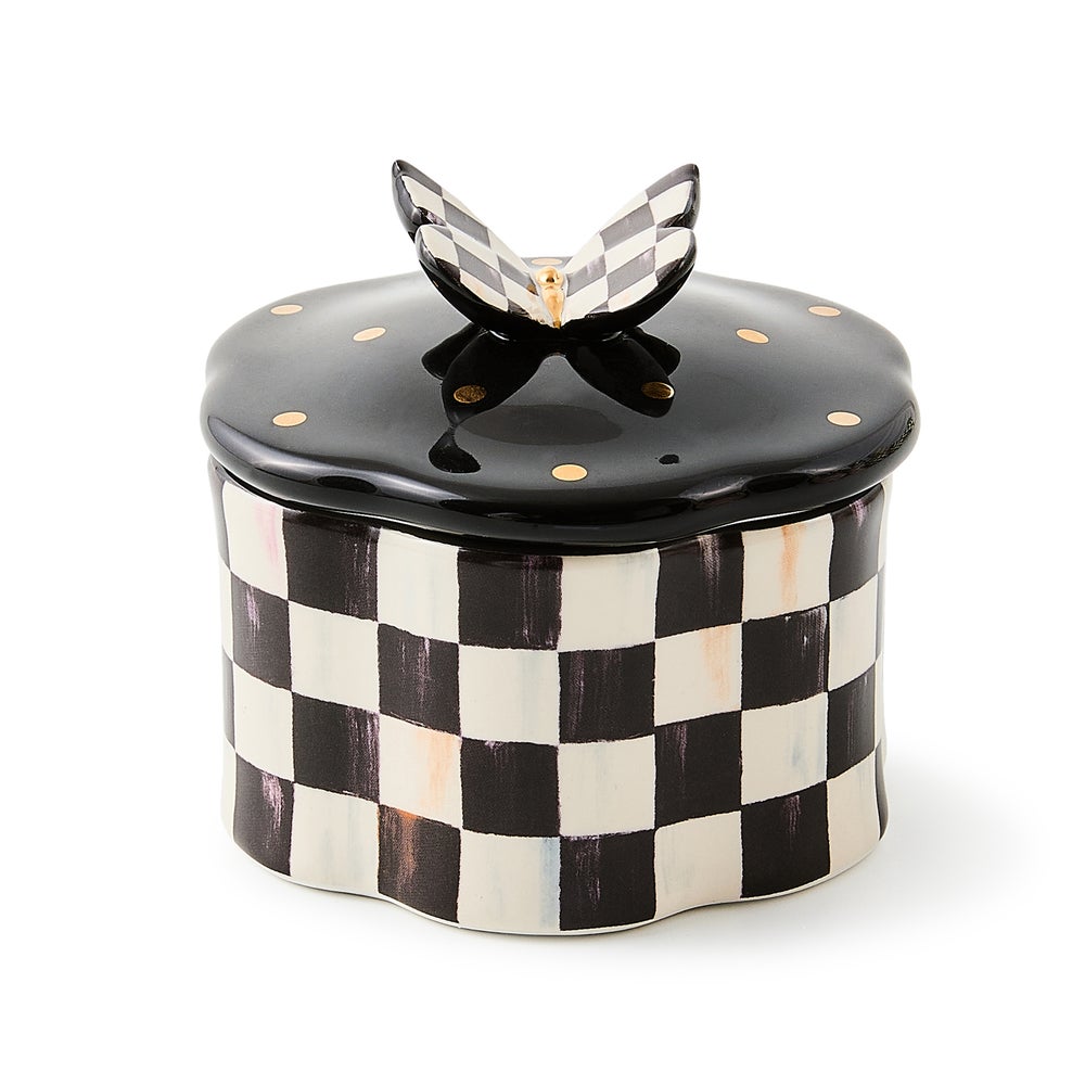 Hand-painted checkered ceramic trinket box with a black gold-dotted lid and butterfly finial.