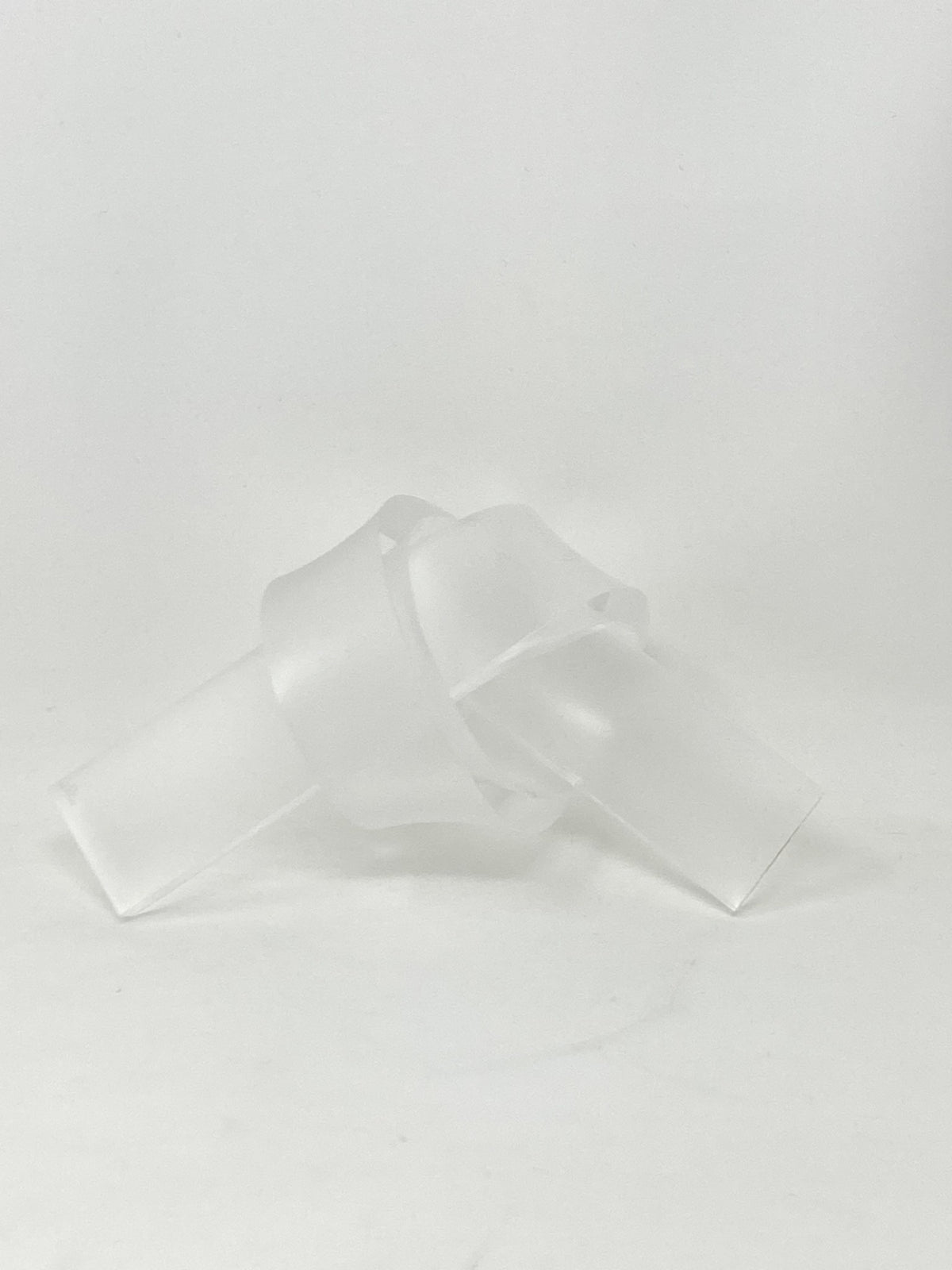 Acrylic knot pendant in clear acrylic with a black cord chain.