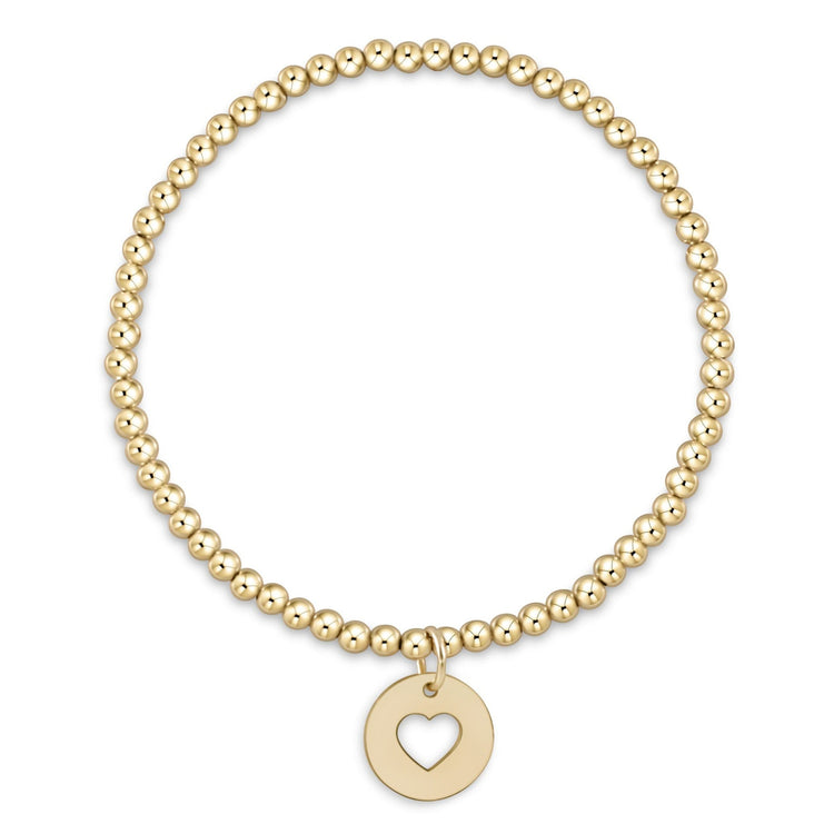 Classic gold-filled bracelet featuring a central love disc surrounded by small beads on elastic cord.