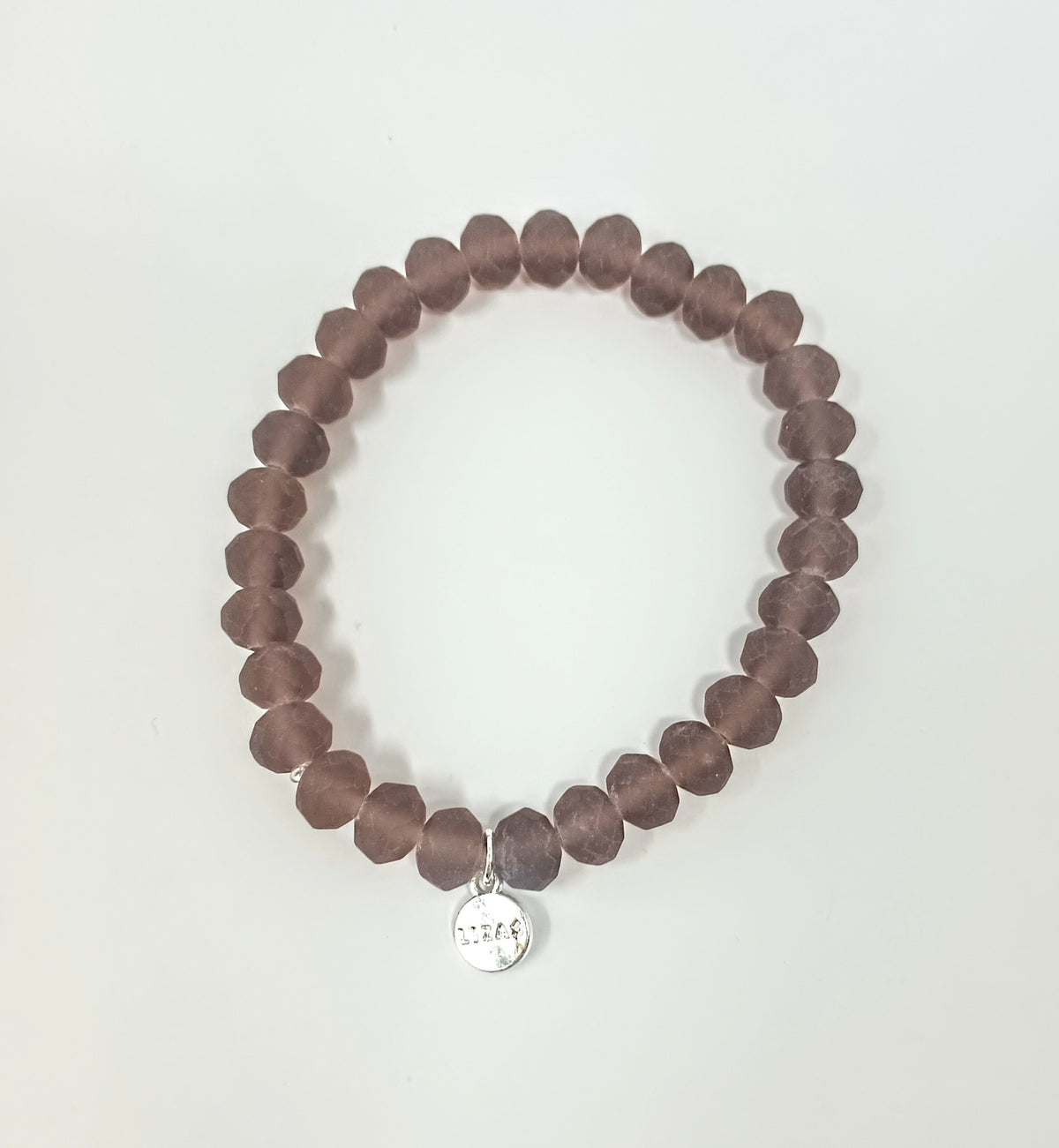 Stretchy bracelet with faceted glass beads in assorted colors.